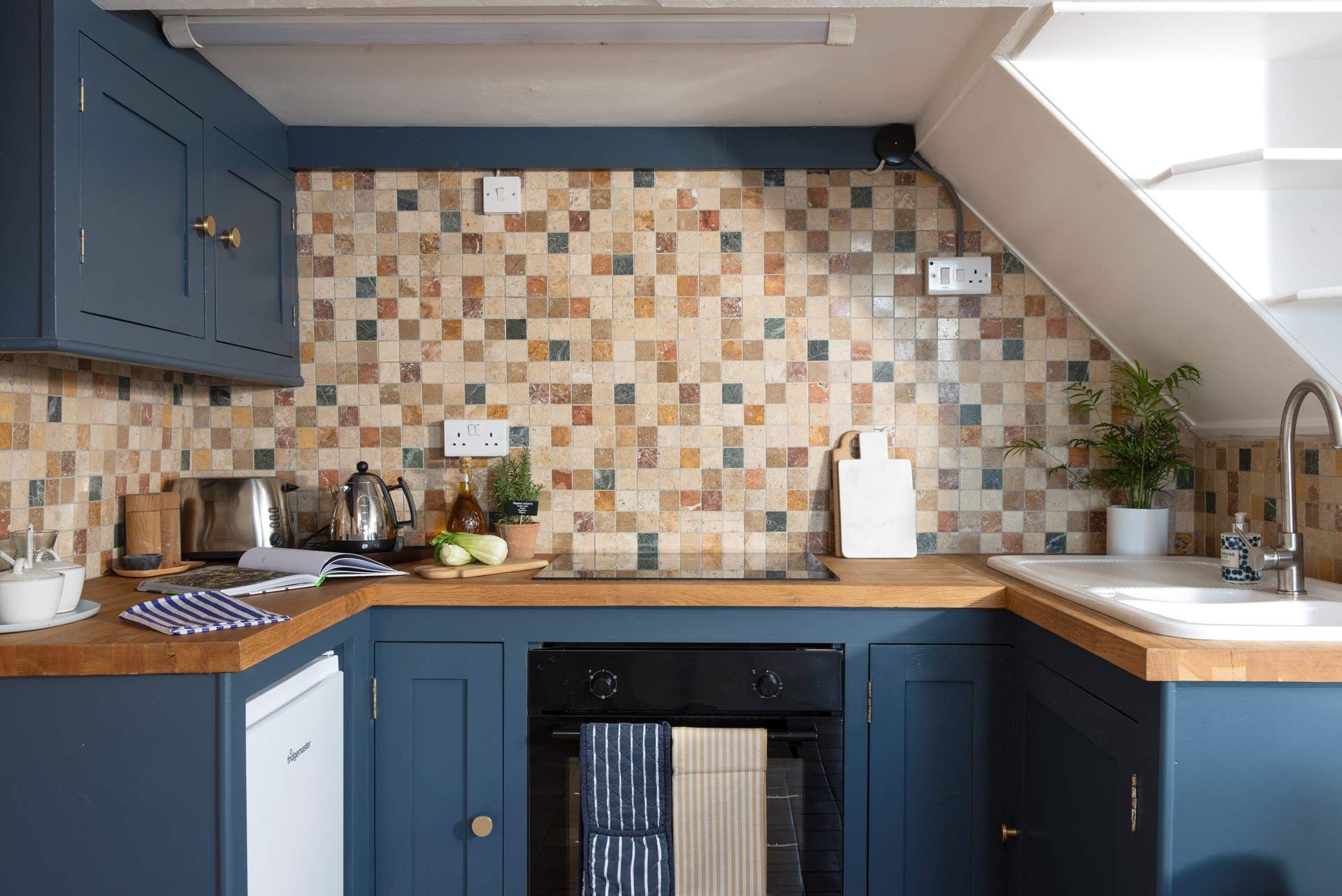 A cute kitchen to cook up a feast.