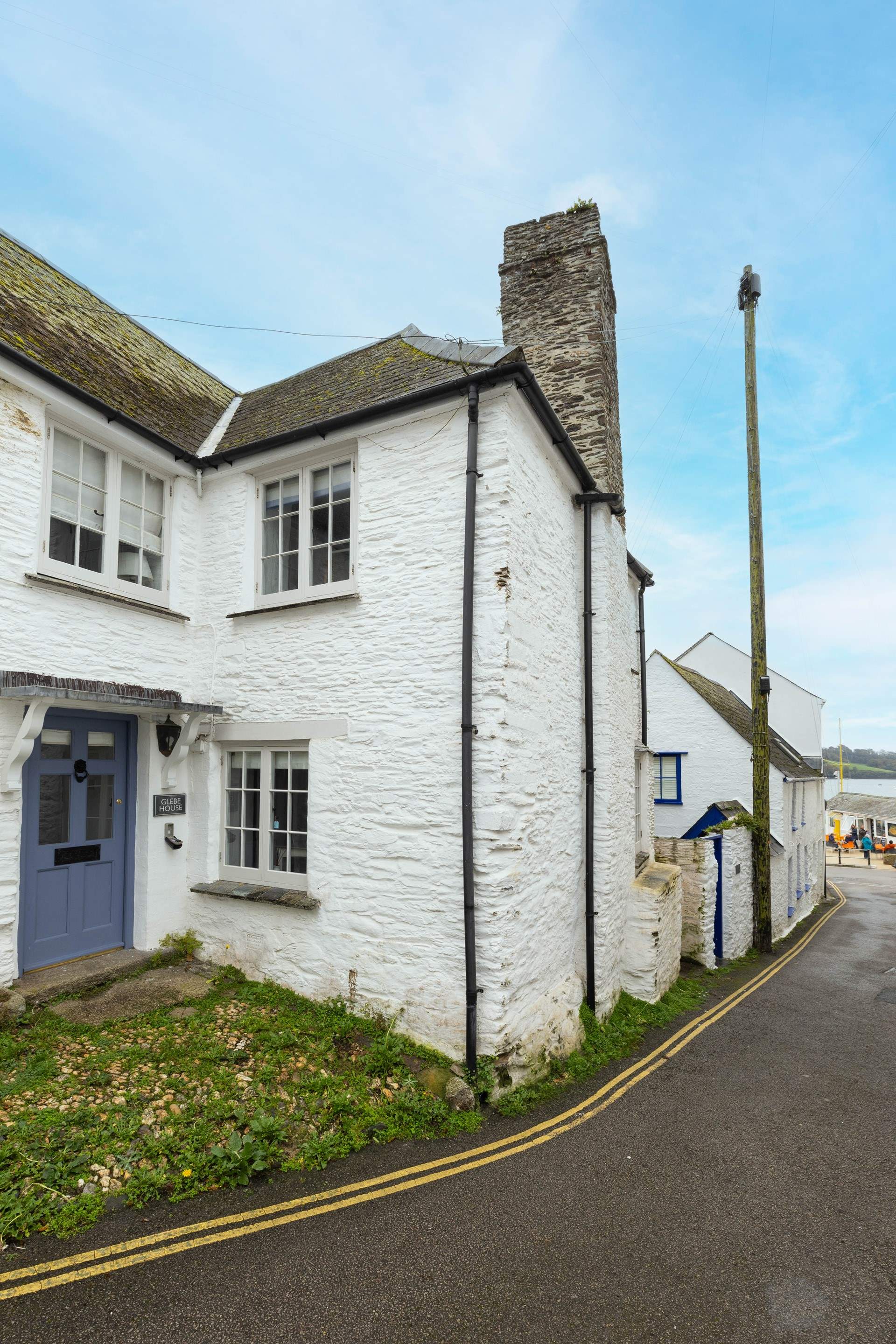 The pretty harbour and a selection of shops and eateries close by.