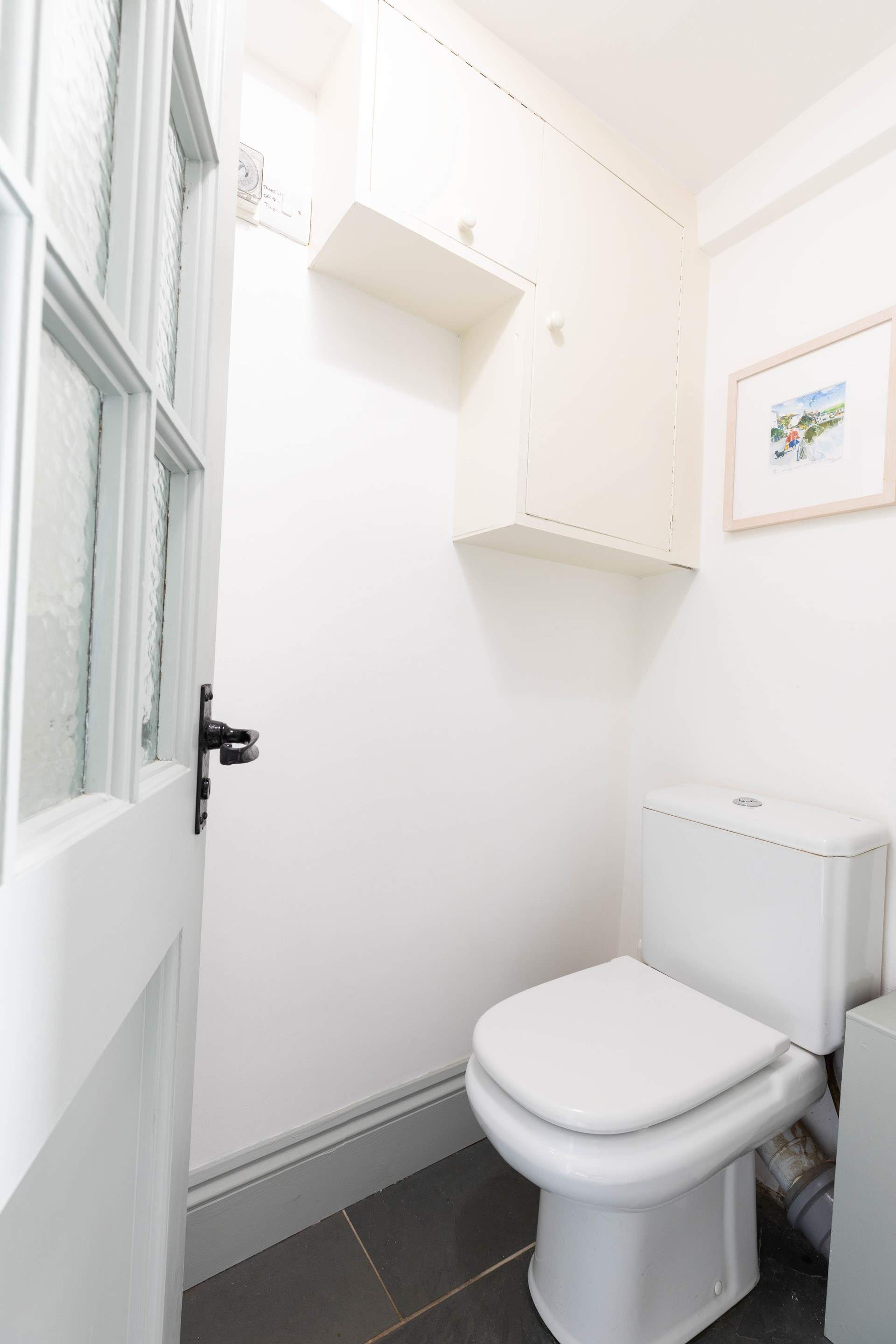 The handy ground floor cloakroom.