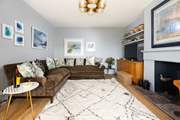 The large, comfortable sofa awaits, ideal for cosy evenings in.