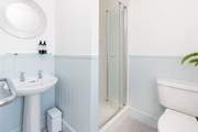 Bedroom 1 has an en suite shower-room.