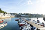 Sit by the harbour and watch the tide ebb and flow.