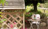 Enjoy a glass of wine outside in the pretty garden. - Thumbnail Image