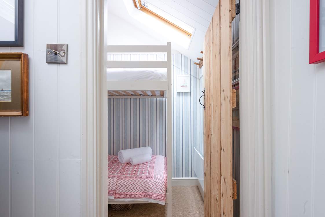 The small second bedroom with bunk-beds.