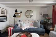 A cosy sitting-room with a 'sink into' sofa.