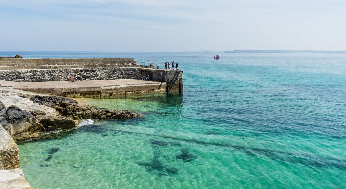 Crystal clear turquoise blue waters in St Ives, a swimmer's paradise.