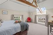 Bedroom 1 offers low level views out over the courtyard and the glorious Devon countryside.