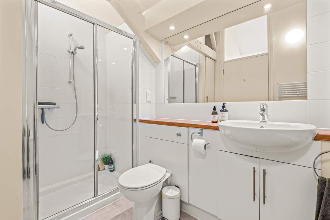 The family bathroom offers both a bath and shower cubicle.