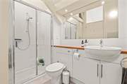The family bathroom offers both a bath and shower cubicle.