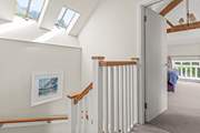 Heading upstairs, the landing links both bedrooms and the bathroom neatly.