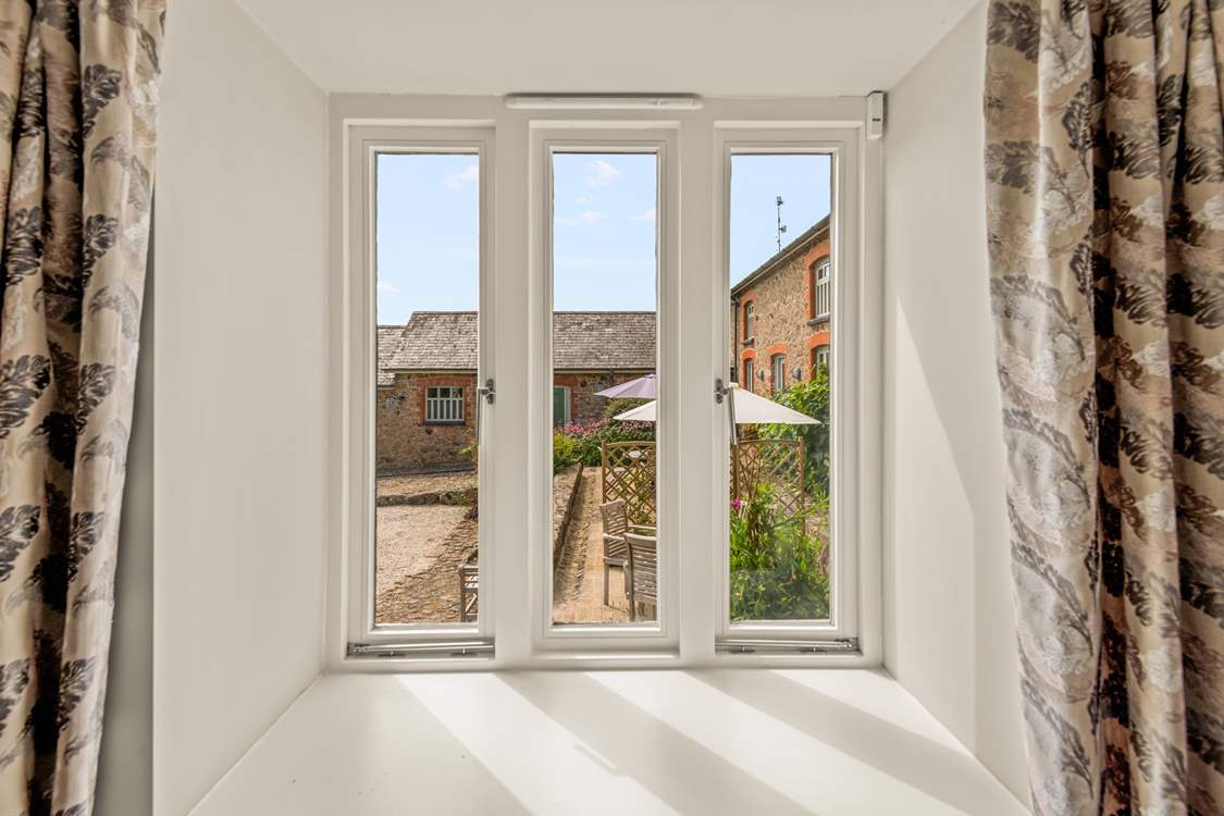 Peeking out onto the patio-area and courtyard from the living-room window.
