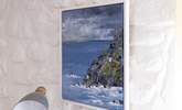 Whitewashed stone walls highlight the owner's artwork.  - Thumbnail Image