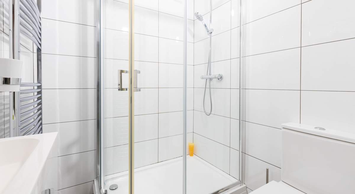 A modern bathroom complete with power shower to wash away the day.