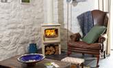 Snuggle up by the cosy wood-burner on chillier nights. - Thumbnail Image