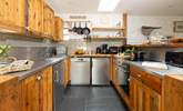 The kitchen is assembled from recycled wood, practical, functional and quirky.   - Thumbnail Image