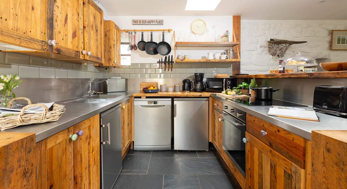 The kitchen is assembled from recycled wood, practical, functional and quirky.  