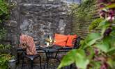 Enjoy dinner al fresco in the pretty secluded garden. - Thumbnail Image