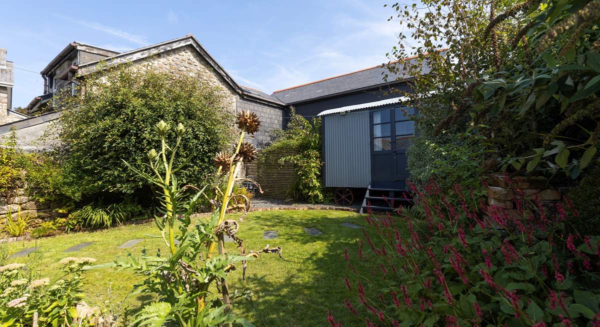 Such a sweet private garden to relax in, with a snug summer house.