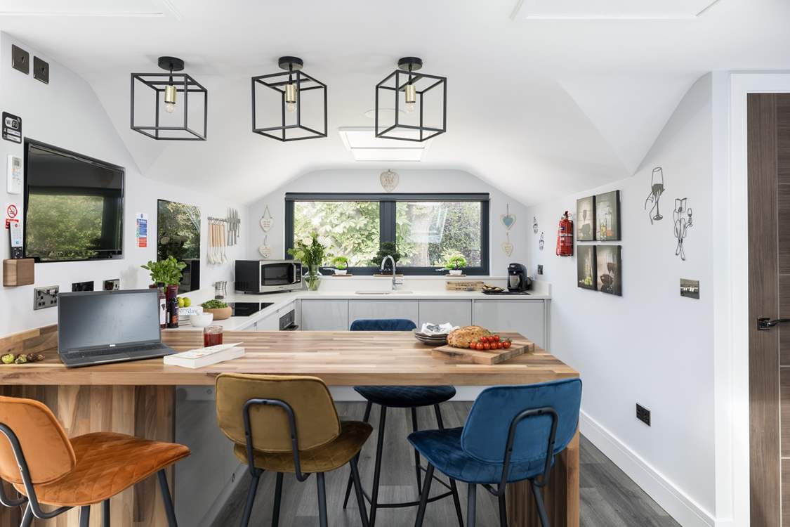 The beautifully modern breakfast-bar and kitchen-area is a great place to start the day at Chestnut Retreat.