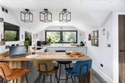 The beautifully modern breakfast-bar and kitchen-area is a great place to start the day at Chestnut Retreat.