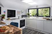 The contemporary kitchen has everything you need to whip up a feast to share.