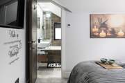 Straight through to the en suite with a rainfall shower over the bath.