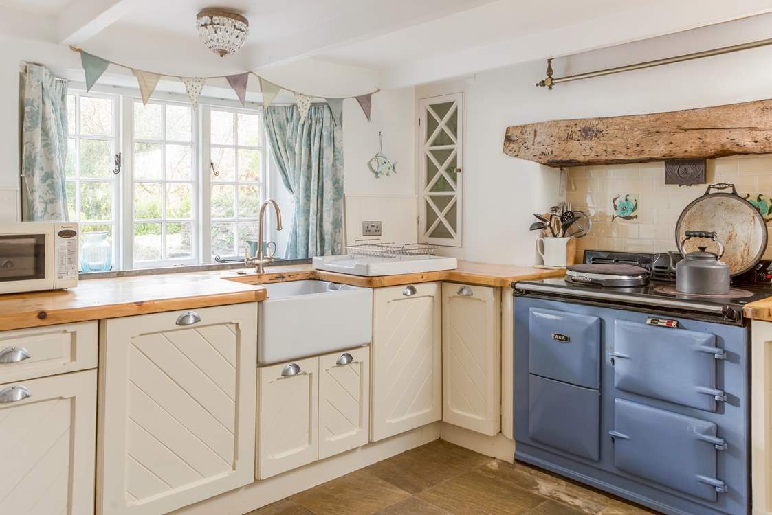 Enjoy looking over the pretty front garden from the kitchen sink.