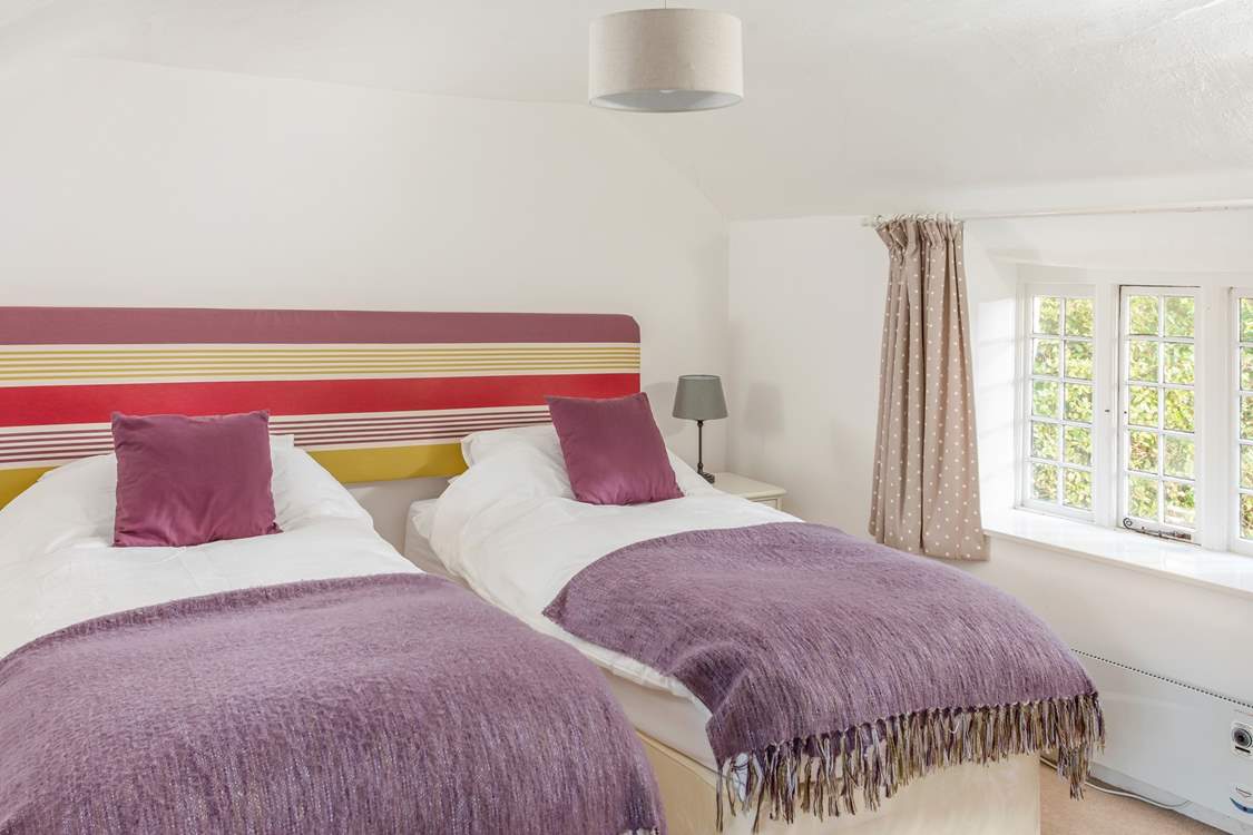 This bedroom has fun pops of colour.