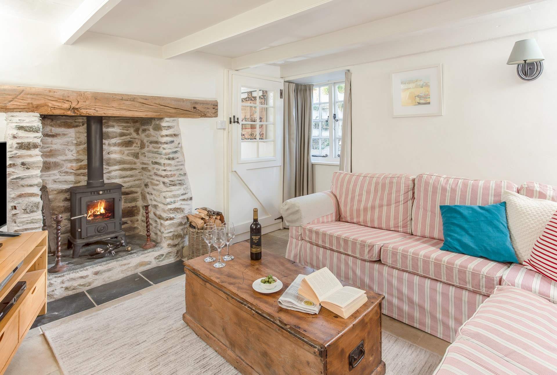 The second sitting-room has a large corner sofa for everyone to fit on. 