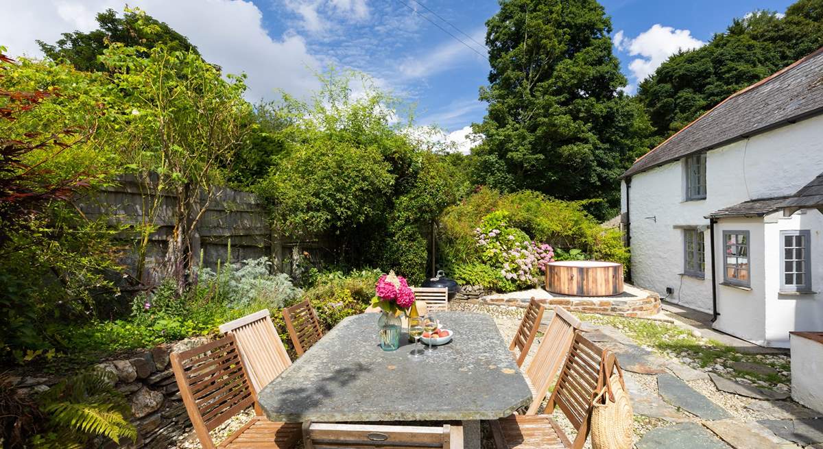 The sheltered sunny back garden. The hot tub can be hired by a separate company at an extra cost. 