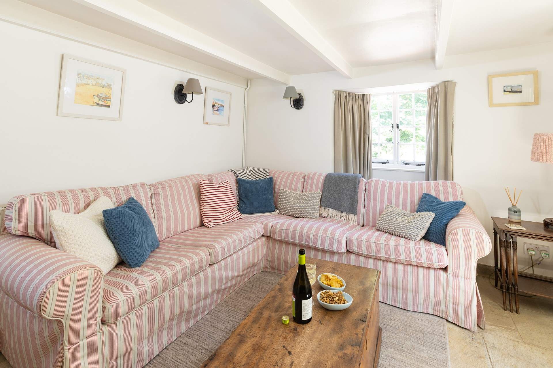 The second sitting-room has a large corner sofa for everyone to fit on. 