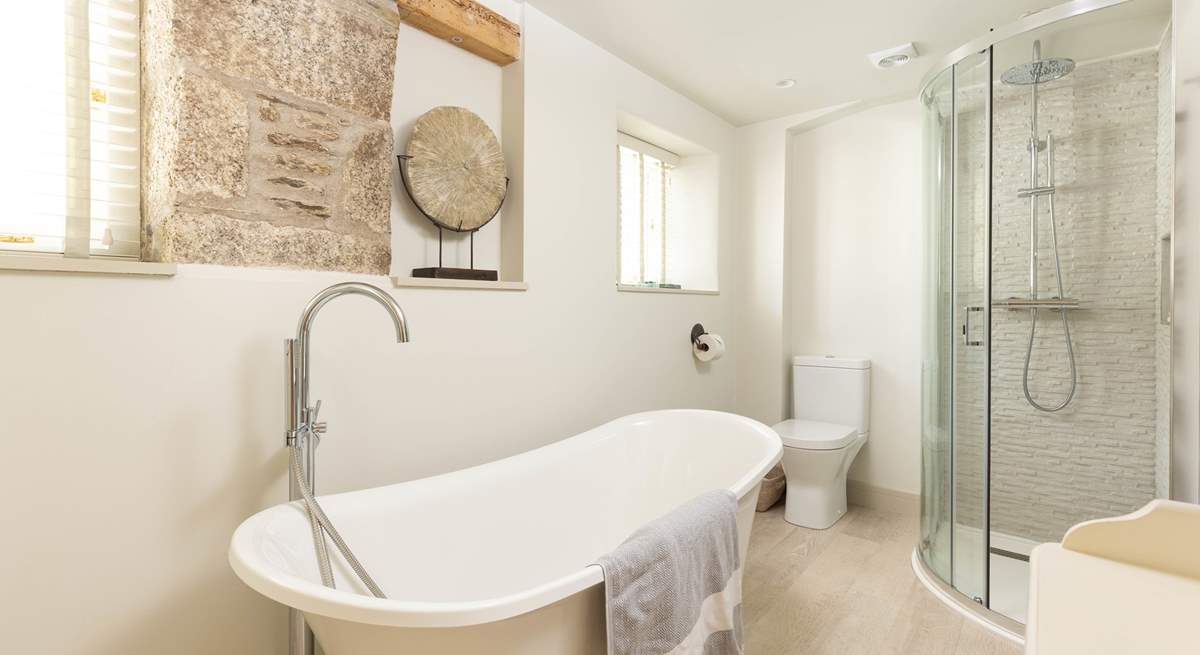 The luxurious bathroom has the most magnificent tub. 