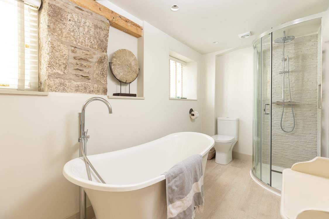 The luxurious bathroom has the most magnificent tub.