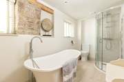 The luxurious bathroom has the most magnificent tub.