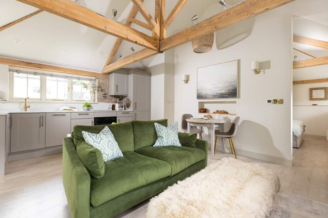 The open plan living space still ensures the feeling of room, with the bedroom tucked around the corner to feel snug.