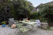 The pretty patio catches the afternoon sun.
