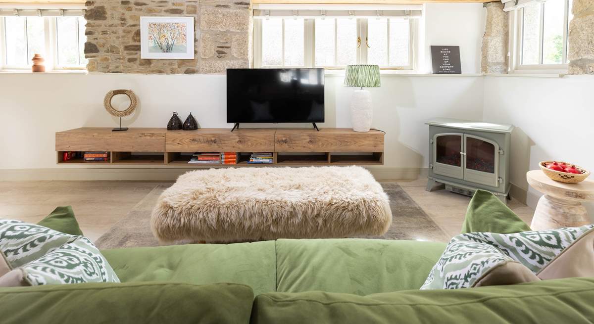 Snuggle those toes into the sheepskin and feel the glow of the electric wood-burner on a winter's eve. 