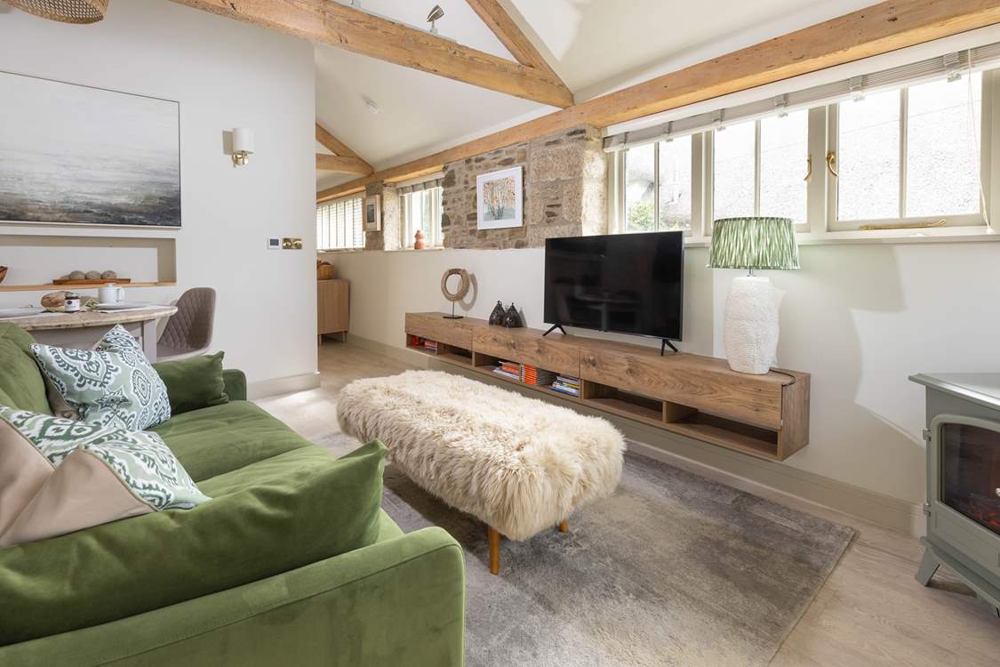 The bedroom and bathroom can be found tucked around the corner.