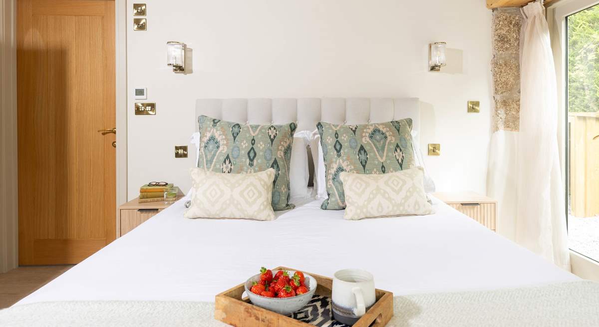 Luxurious crisp white linens on the sumptuous king-size bed. 