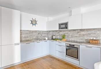 The sleek kitchen has all you need to get culinary creative.