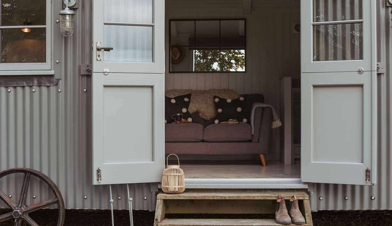 The double doors allow the natural light to stream through. 
