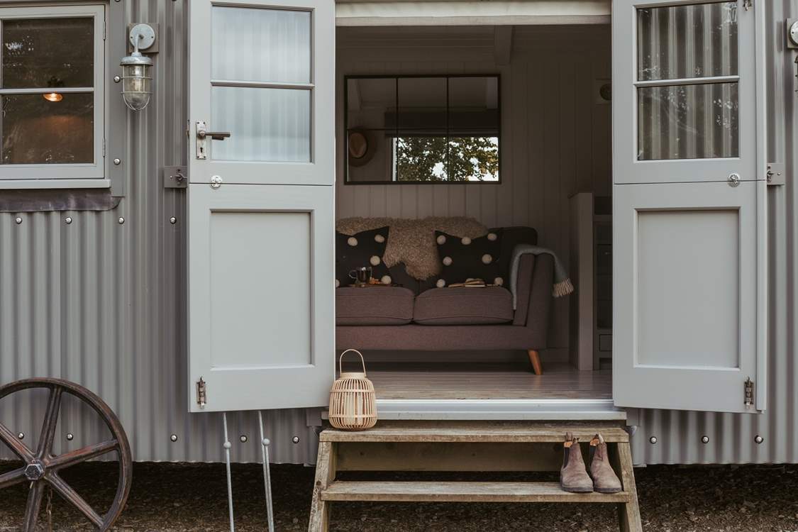 The double doors allow the natural light to stream through.