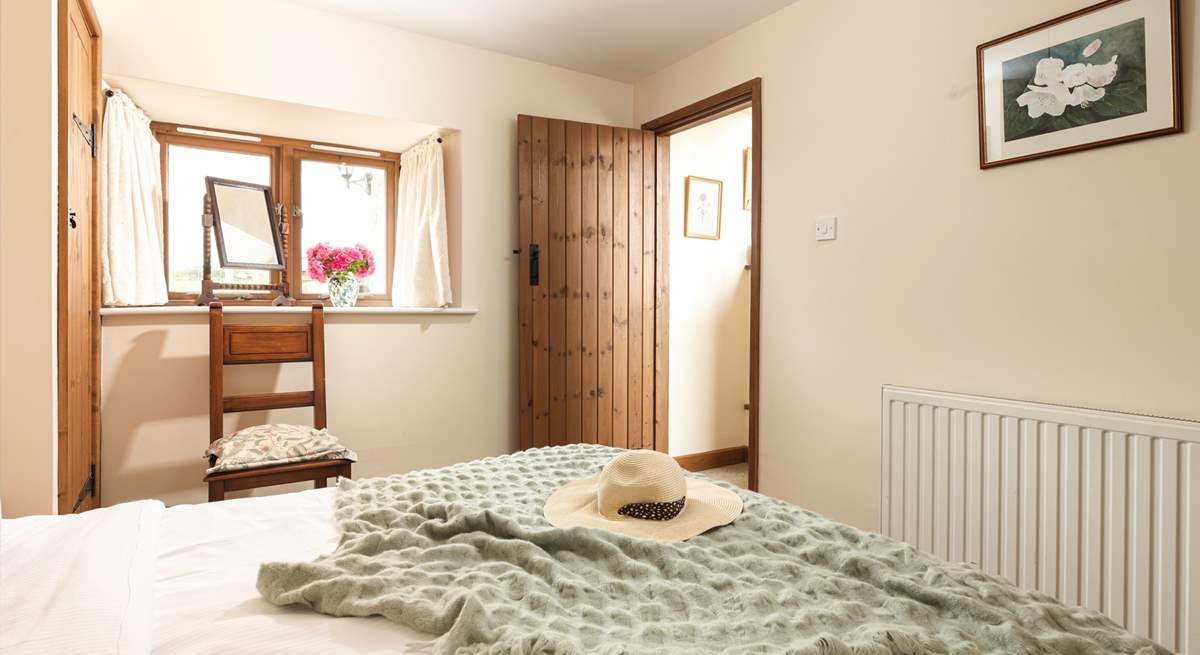 There is a wide window sill, with a make-up mirror - and a view over the courtyard to the fields beyond. 