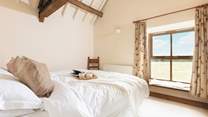 You won't want to leave this serene and inviting bedroom.