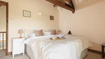 Enjoy the original exposed beams in the upstairs bedroom.