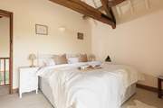 Enjoy the original exposed beams in the upstairs bedroom.