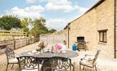 The charming outdoor space, ideal for evening drinks on a sunny day (please note, the barbecue provided is charcoal). - Thumbnail Image