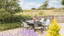 Outside The Gallery there's a wraparound gravelled courtyard, with a large outdoor dining-table.