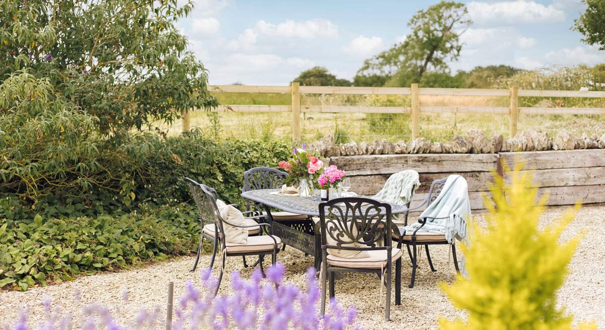 Outside The Gallery there's a wraparound gravelled courtyard, with a large outdoor dining-table.