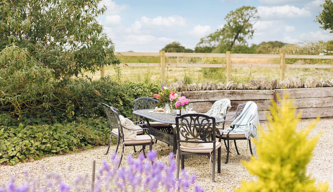 Outside The Gallery there's a wraparound gravelled courtyard, with a large outdoor dining-table.
